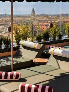 an outdoor seating area overlooking the city