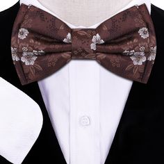 Brown Original Floral Bow Tie A simple yet elegant brown floral bow tie is all that is needed to transform your look into the perfect looking outfit for any occasion. Choose From: Single Bow Tie Bow Tie and Pocket Square Type Of Bow Tie: Self-Tie Pre-Tied Material of Bow Tie and Pocket Square: 100% Silk Bow Tie Fits Neck Sizes: 14 - 22” Inches Pattern On Fabric: Floral Color Of Fabric: Brown, White Elegant Brown Bow Ties, Classic Brown Bow Tie, Elegant Brown Bow Tie With Bow Tie Back, Elegant Brown Suit And Tie Accessories With Bow Tie, Elegant Brown Bow Tie Suit Accessories, Elegant Brown Bow Tie With Satin Bow, Elegant Brown Bow Tie, Elegant Brown Satin Bow Tie, Classic Brown Bow Tie For Formal Occasions