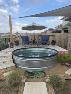 an outdoor hot tub sitting on top of a patio