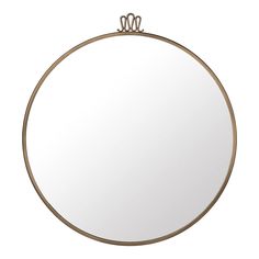 a round mirror with two metal rings on the top and one is hanging from it's side