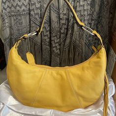 Worthington Genuine Leather Yellow Purse Shoulder Bag Hand Bag Casual Or Dressy. Side Tassell With Zipper Compartment. Inside Zipper Compartment Plus Two Inside Pockets. Yellow Lining. Lightweight. Medium Size. Condition : Fair. Although I've Never Used This Bag I Am Seeing A Few Tiny Flaws. Not Very Noticeable But Just Being Transparent. Price Reflects This. Casual Yellow Satchel Affordable, Elegant Hobo Bag With Detachable Handle For Spring, Elegant Spring Hobo Bag With Detachable Handle, Elegant Summer Crossbody Hobo Bag, Elegant Summer Hobo Bag, Summer Leather Hobo Bag, Elegant Leather Hobo Bag For Spring, Elegant Spring Hobo Bag For Shopping, Elegant Spring Hobo Bag For Daily Use