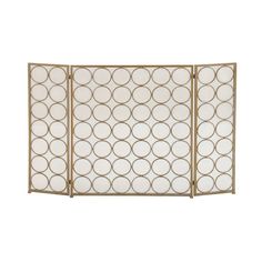 an iron screen with circles on the top and bottom, in gold metal finish against a white background