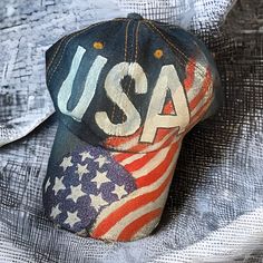 Nwt. Denim Baseball Cap With Hand Painted Usa On The Front. Glittery American Flag Going Up From The Rim Of The Hat To The One Side. Adjustable Back. Blue Baseball Cap For 4th Of July, Painted Ball Cap, Painted Baseball Cap, Paper Boy Hat, Leather Bucket Hat, Hat Art, Paper Boy, Denim Baseball Cap, Painted Hats