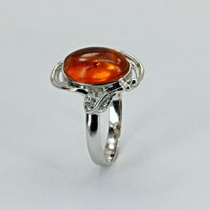 This is a beautiful Baltic Amber Ring in .925 Sterling Silver. The Amber is right from the capital of amber: the city of Gdansk / Danzig in Poland. The ring is made out of solid 925 Silver and there is no nickel or other substances causing most allergies in the silver making the ring hypo allergenic. Size of the Amber 1.1 x 0.8 cm 0.43 x 0.31 inch Weight of the Ring 2.9 grams 0.10 oz You will receive the item in a gift box - perfect to surprise someone or yourself. Usually we ship on the same da Classic Amber Sterling Silver Ring, Classic Amber Ring With Polished Finish, Classic Orange Rings With Polished Finish, Orange Sterling Silver Ring, Sterling Silver Orange Ring With Polished Finish, Orange Sterling Silver Ring With Polished Finish, Formal Orange Sterling Silver Rings, Amber Ring, Gdansk