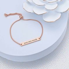 Any woman will look and feel great in this adjustable slide bracelet. We'll custom engrave it with your own words. It's a great gift for weddings, birthdays, Christmas, or Valentine's Day! CUSTOM ENGRAVING: ENGRAVING: [Your Own Words - 25 character max] BACK: [Optional, adds $10, 25 character max] DETAILS: MATERIAL: stainless steel FINISHES: gold, rose gold, stainless steel FIT: adjustable, one size fits most STYLE: slide, fits over hand BRACELET SIZE: up to 9 inches in diameter Personalized Adjustable Meaningful Jewelry, Meaningful Personalized Adjustable Jewelry, Adjustable Jewelry With Custom Text For Personalized Gift, Adjustable Custom Text Jewelry For Personalized Gifts, Custom Text Adjustable Jewelry, Elegant Adjustable Name Bracelet With Custom Text, Inspirational Adjustable Jewelry With Engraving Option, Elegant Custom Text Name Bracelet, Adjustable Nameplate Jewelry With Engraving Option