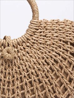 an image of a handbag that is made out of woven material and has a handle