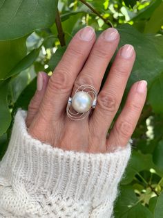 Natural white mabe pearl ring with round swirls on both sides. Sterling Silver 925 . Unique design. Pearl diameter 1.3cm Unique White Pearl Ring, Unique Oval White Pearl Ring, Unique White Oval Pearl Ring, White Pearl Ring, Mabe Pearl, June Birthstone, June Birth Stone, Pearl Ring, White Pearl