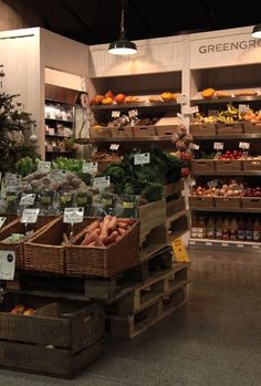 the produce section of a grocery store is stocked with fresh fruits and veggies