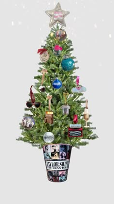 a small christmas tree with many ornaments in it