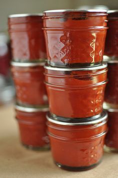 there are many jars that have red sauce in them