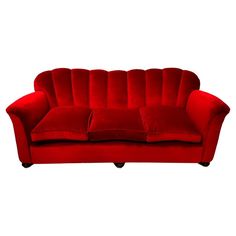 a red couch sitting on top of a white floor