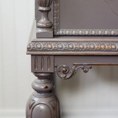 an ornate wooden desk with a mirror on top