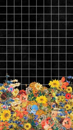 a black tiled wall with colorful flowers in the foreground and an image of sunflowers on the ground