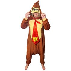 This Donkey Kong union suit is a cozy costume choice; it's made of plush fleece and comes in an exaggerated baggy style. DK's face is embroidered on the hood and his large red satin tie is attached at the neck with a yellow DK logo printed at the bottom. The one-piece jumpsuit makes transforming into Donkey Kong quick and easy so you can get to protecting your bananas or antagonizing Mario in no time. pbAdult Donkey Kong One Piece Zipster Costume product details:-b-p ul liOversized fit-li liFront zipper closure-li liEmbroidered character face on hood-li liAttached oversized tie-li liElastic wrists and ankles-li liPolyester-li liReview the size chart for sizing information-li -ul liOfficially licensed Donkey Kong costume.-li pbCare Instructions:-b-p ul liMachine wash cold with like colors-l Novelty Costumes For Winter Costume Party, Novelty Winter Costumes For Costume Party, Novelty Costumes For Costume Party In Winter, Novelty Winter Cosplay Costumes, Donkey Kong Costume, Donkey King, Dk Logo, King Costume, Character Face