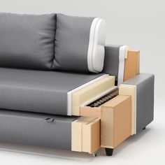 a couch with two drawers on it and an arm rest in front of the couch