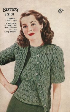 a woman in green sweater and pants with her hands on her hips