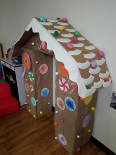 a gingerbread house made out of paper plates