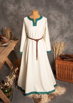 The dress has simple medieval cut with long sleeves, loose and comfortable. The historical pattern - an important element when playing historical realities, especially Vikings or Slavs. Put on your cloak and travel back to the Middle Ages. Hunting, ancient legends, the warmth of the hearth and our dress will give you an unforgettable experience. The simple cut of the dress allows you to move freely, as well as boldly add accessories to the dress. The dress will perfectly fit into the basic wardr Viking Style Long Sleeve Medieval Dress For Festivals, Long Sleeve Dresses For Medieval Festivals, Viking Style Medieval Dress With Long Sleeves, Viking Style Long Sleeve Medieval Dress, Long Sleeve Medieval Dress For Larp, Long Sleeve Medieval Dress With Historical Design For Festivals, Fall Medieval Dress With Long Sleeves, Long Sleeve Medieval Dress With Historical Design For Fall, Fall Medieval Dress With Historical Design