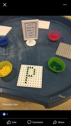 a blue tray topped with different types of beads