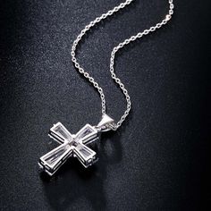 Love the New Elegant Cubic Zirconia Cross Necklace? Sometimes You Never Know The True Value Of A Moment Until It Becomes A Memory. And then you have this beautiful piece of jewelry to remind you of that special moment wherever you go. When was the last time you treated yourself to a lovely gift that reminds you of the most important events in your life? Carry your cross every day and remember what true love looks like. The New Elegant Cubic Zirconia Cross Necklace is carefully crafted with coppe Mother's Day Cubic Zirconia Pendant Jewelry, Birthstone Cross Pendant Jewelry For Anniversary, Anniversary Cross Pendant Necklace With Cubic Zirconia, Crystal Cross Pendant Clavicle Chain, Crystal Clavicle Chain With Cross Pendant, Crystal Cross Clavicle Chain Jewelry, Fine Jewelry Cubic Zirconia For Anniversary Gift, Crystal Clavicle Chain With Cross Shape, Crystal Cross Clavicle Chain