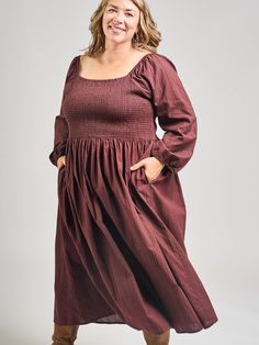 This is a modified version of our Teddy Midi dress, with long sleeves for chillier days. This midi dress features pretty sleeves, an elastic bodice with a flattering fit, and hidden pockets. Cut from a rich, yarn-dyed maroon cotton, this subtle print is a stunner. 100% Cotton Small-batch yarn dyed fabric Hidden pockets Elasticated bodice Length from center front of size 2X is 46" Made fair trade in India by one of our longstanding production partners Fall Dresses With Smocked Cuffs And Square Neck, Fall Smocked Dress With Square Neck And Smocked Cuffs, Billowy Long Sleeve Maxi Dress For Daywear, Fall Season Relaxed Fit Maxi Dress, Relaxed Fit Fall Maxi Dress, Smocked Relaxed Fit Midi Dress, Fall Long Sleeve Dress With Gathered Bishop Sleeves, Billowy Long Sleeve Maxi Dress With Gathered Sleeves, Billowy Long Sleeve Casual Midi Dress