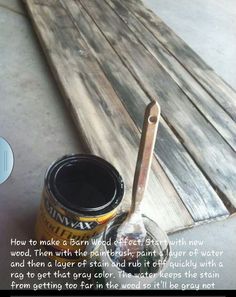 a can of paint sitting on top of a wooden bench