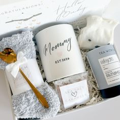 a gift box containing tea, body lotion and other items