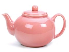 a pink teapot with a lid on it's side, sitting on a white surface