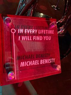 a red sign that says in every lifetime i will find you michael benisty