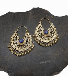 HANDMADE Beautiful Mandala hoop earrings with gemstones.l dangle details. Ideal for a special bohemian look. SIZE Aprox Length: 5.4 cm Aprox diameter: 3.5 cm Handmade with high quality hypoallergenic Jewelery brass, nickel free. LINK Please follow the link to view my shop for other beautiful pieces. https://www.etsy.com/uk/shop/JagathaStudio Handmade Metal Drop Chandbalis, Bohemian Brass Chandbalis For Festive Occasions, Blue Festival Earrings With Latkans, Handmade Adjustable Traditional Hoop Earrings, Traditional Handmade Adjustable Hoop Earrings, Turquoise Jewelry With Latkans For Festivals, Festive Turquoise Jewelry With Latkans, Turquoise Latkans Jewelry For Festivals, Handmade Metal Chandbalis