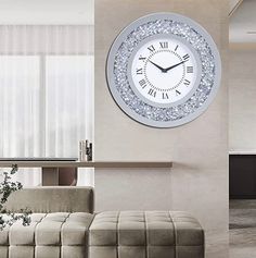 a living room filled with furniture and a large clock on the wall above it's face