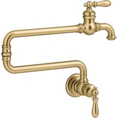 an antique brass faucet with two handles