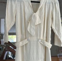 "Beige silk no label dress from the 1920s. Beautiful construction, pearl buttons, and floral details throughout. Great condition - photographed minor damage to silk due to age. Very wearable! 16\" shoulder 34\" chest 30\" waist 38\" hip" Formal Cream Fitted Silk Dress, Vintage Silk Daywear Dresses, Vintage Silk Day Dresses, Victorian Silk Dress For Vintage Events, Silk Victorian Dress For Vintage Events, Vintage Silk Dresses For Daywear, Cream Vintage Dress For Summer Formal Events, Cream Vintage Dress For Summer Formal, Silk Cream Dress For Vintage Events