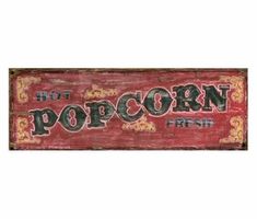 a red sign that says, hot popcorn fresh on the front and back of it