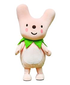 a pink stuffed animal with a green bow around its neck and eyes, standing upright in front of a white background