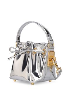 Height: 13cm Width: 12cm Depth: 12cm. Strap drop: 47cm. Handle drop: 7cm. Detachable strap. Single top handle. Drawstring closure. Metal feet at base. Gold-colored metal hardware. Leather lining Designer Handheld Bucket Bag With Handle Drop, Designer Gold Bucket Bag With Detachable Handle, Luxury Silver Bucket Bag For Party, Luxury Silver Bucket Bag For Evening, Modern Handheld Bucket Bag With Gold-tone Hardware, Luxury Silver Bucket Bag With Silver-tone Hardware, Evening Bucket Satchel With Handles, Luxury Handheld Bucket Bag For Evening, Evening Bucket Satchel