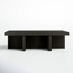 a black table sitting on top of a white floor