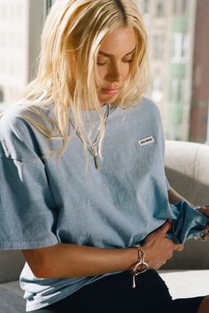 Classic and oversized crew neck tee featuring our signature logo patch. Our heavyweight cotton fabric is vintage-inspired and timeless. It gets better and more worn in with every wash. Just the way you want it. Color: Denim Cotton w/ Logo Sizing: S/M (0-4), M/L (6-10) MODEL IS 5'8" AND WEARING A SIZE S/M Fabric: 100% Cotton Care: Machine Wash Cold, Separately.Care: Tumble Dry Low. Do Not Bleach or Spot Clean. JOAH BROWN | MADE IN LOS ANGELES W Logo, Joah Brown, It Gets Better, Denim Cotton, Logo Tee, Just The Way, British Indian, Logo Tees, Signature Logo