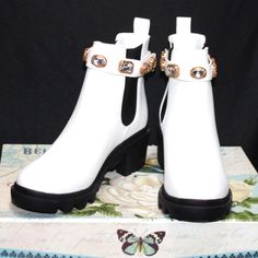 Get Ready To Dazzle In The Inviting Steve Madden Amulet Bootie. Highlighted With Rhinestone-Accented Strap For That Bling Touch, This Pull-On Bootie Has Flexible Elastic Stretch Panels, Cozy Footbed And Lug Tread Sole With Chunky 2" Block Heel And Platform For Stability. White Leather Boots With Rhinestones, White Rhinestone Boots With Round Toe, White High Heel Boots With Rhinestones, White Rhinestone High Heel Boots, Trendy White Boots For Formal Occasions, 2 Block, Steve Madden Shoes, Bootie, Steve Madden