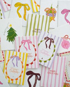 many christmas cards have been made with different colors and designs, including bows on them