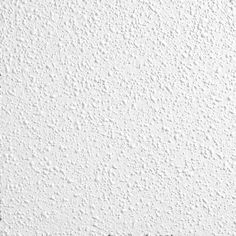 a white wall that has some black and white paint on it