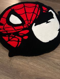 Custom Handmade Spider-Venom rug. Able to customize at different sizes or colors, please message me if you have any questions. At just a glance, this looks like just a tufted vibrant rug, but its a comic inspired art piece. This rug can brighten any room and just add a hint of fun.  This rug is versatile and can be used in any area of your home. Whether you want to place it in your living room, bedroom, or even your kitchen, it will add a cozy and inviting atmosphere to the space. The texture of this rug is soothing to the touch, providing comfort and warmth underfoot.  The rug can be placed anywhere, but I highly suggest its placed in low trafficked areas.  Placing in high trafficked areas will increase wear and tear over time.  To ensure the highest quality, we have used 100% premium acr Custom Tufted Rug, Turfing Rugs, Venom Rug, Spiderman Room Ideas, Spiderman Bedroom, Halloween Rugs, Spiderman Room, Vibrant Rug, Tufting Rug