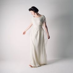 Hedera ~ Celtic Tunic Wedding Dress The Hedera celtic tunic wedding dress is unique. It has its own ethereal lightness and a timeless shape that is reminiscent of Celtic priestesses, of floating greek Goddesses, of long silk gowns blowing free, in the wind. It emanates a natural, elemental feeling, blending effortlessly in the space around it. Composed of three layers of silk fabric, the two bottom layers are cut as one and are loose but sit close to the body, barely skimming it. The top layer i Celtic Tunic, Pagan Wedding Dress, Pagan Wedding Dresses, Short Corset Dress, Wedding Dress Casual, Peach Wedding Dress, Wedding Dress Alternative, Boho Wedding Dress Bohemian, Wedding Dress Bohemian