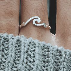 "Our Dainty Wave Ring is perfect made for every beach lover and mermaid who dreams of salt in her hair and sun on her skin. \"Let the waves take you on a journey\". ✅ PRODUCT DETAILS * Material: solid sterling silver. * Wave length is 20mm and 1.3mm thick. * We use US ring size (please refer to the last picture for the instruction to find your size at home without sizing tool). ✅ PRODUCTION & SHIPPING INFO 📌 Important: please be aware that the shipping time does not include the production t Adjustable Wavy Rings As A Gift, Wavy Stackable Rings, Wave Jewelry Surfgirl, Handmade Ocean-inspired Rings, Adjustable Silver Rings With Ocean-inspired Style, Silver Wave Ring, Silver Rings Wave, Ocean Wave Ring, Fimo Ring