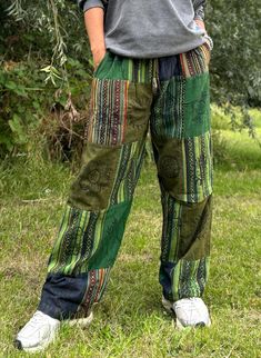 Step into ultimate comfort and effortless style with our unisex baggy spiritual pants, made from thick, durable Gheri cotton fabric. These trousers are perfect for festivals, yoga, or everyday wear and are designed for anyone who loves to embrace a free-spirited lifestyle. With a unique spiritual print, these pants will make you stand out while keeping you comfortable in every situation! ✨ Size & Fit Details ✨ - Free size elasticated waist with drawstring closure:  Fits waist sizes 26-40 inches Gypsycore Fashion Men, Mens Hippie Fashion, Baggy Green Patchwork Pants, Hippie Summer Patchwork Pants, Green Patchwork Hippie Pants, Hippie Full-length Pants For Festival, Hippie Wide-leg Parachute Pants For Festival, Geeky Clothes, Yoga Pant