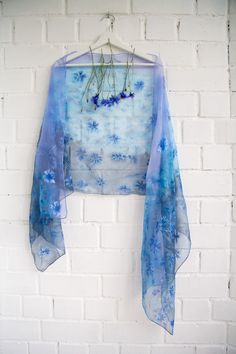 Hand painted luxury Silk Chiffon scarf Cornflowers in Periwinkle sky, Cornflower Blue field and some navy/petrol blue accents. Chiffon is very light and transparent pure silk fabric. It looks so beautiful and mysterious in layered applications. -------------------------------------------------------------------------------------------------------------------------------------------------------------------- This design Scarf is MADE TO ORDER and available in 2 SQUARE and 5 OBLONG sizes: 21*x21 in Blue Silk Scarves For Spring, Blue Bohemian Silk Scarf For Spring, Bohemian Blue Silk Scarf For Spring, Summer Blue Silk Scarf, Summer Purple Silk Scarf, Bohemian Blue Dupatta For Spring, Summer Silk Shawl With Floral Print, Blue Floral Print Shawl For Spring, Artistic Blue Silk Scarf For Spring