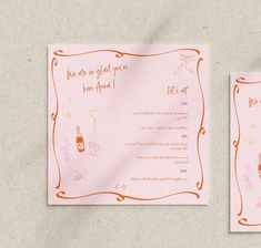 two pink cards with orange writing on them