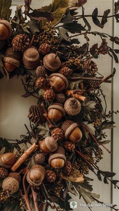 a wreath with acorns and leaves on it