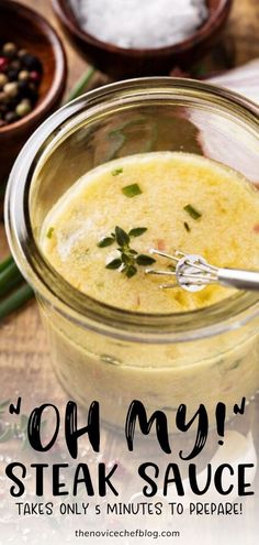 a glass jar filled with soup next to other bowls