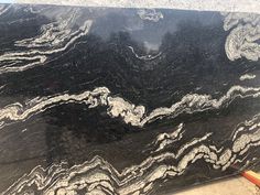 black marble with white swirls on it